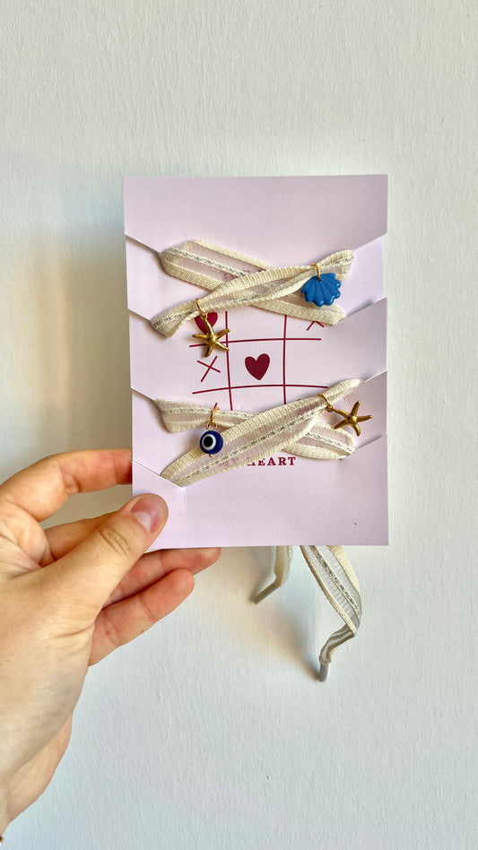 Lacets crème à charms